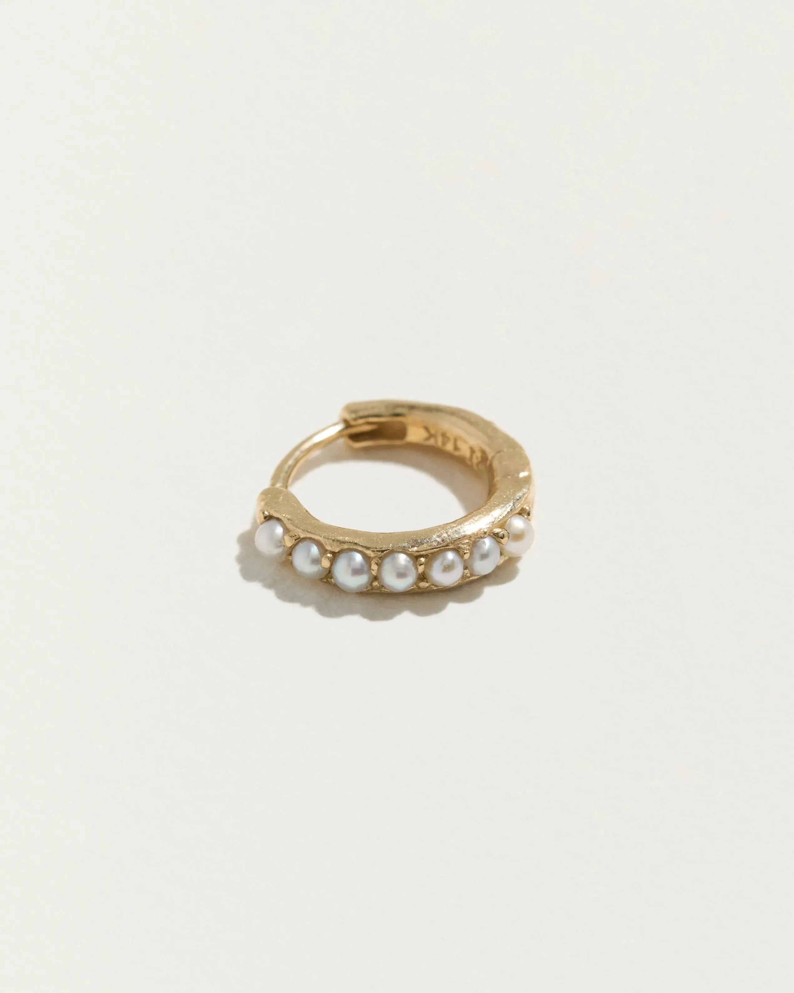 8mm Molten Pavé Huggie sold by Pamela Love