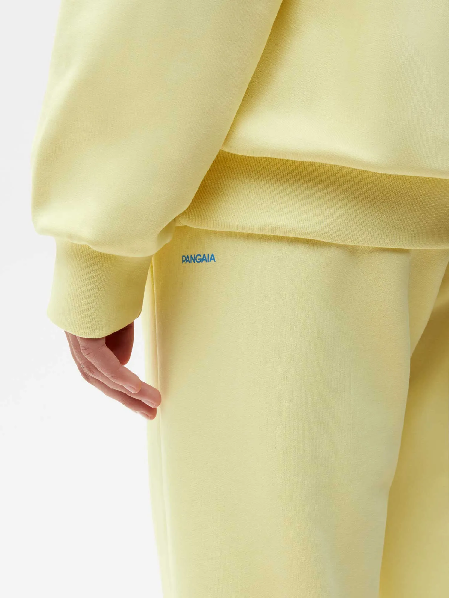 In Conversion Cotton Track Pants—sunbeam yellow sold by Pangaia product image thumbnail 4