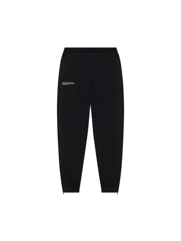 Recycled Cotton Tapered Track Pants—black sold by Pangaia