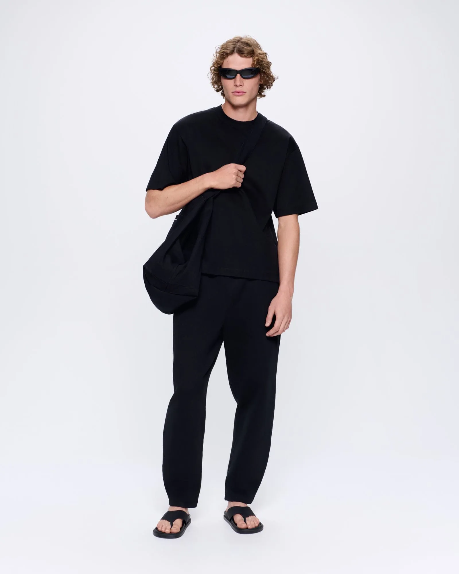 Mens Heavyweight Barrel-Leg Track Pants—black sold by Pangaia