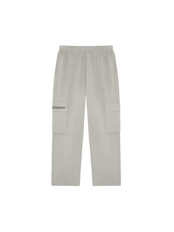 Mens Double Jersey Cargo Track Pants—stone sold by Pangaia
