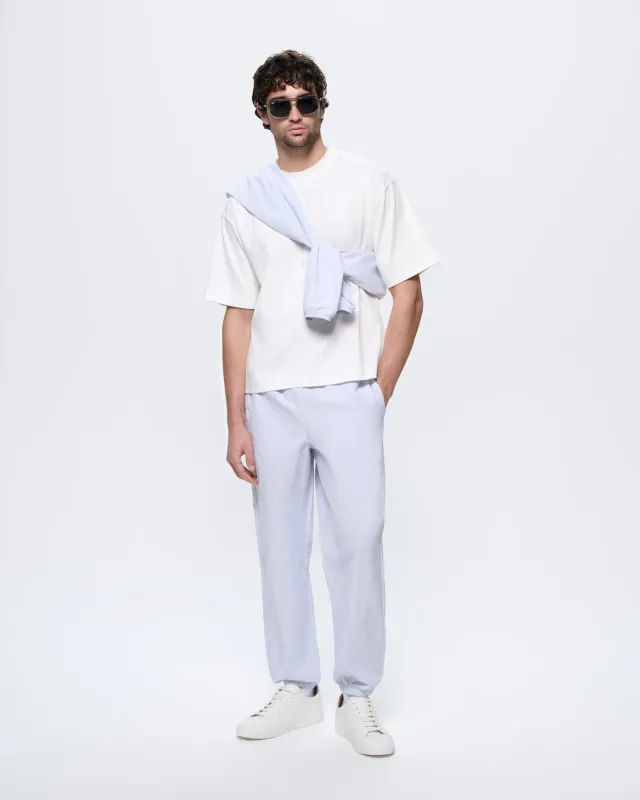 Mens Recycled Nylon Track Pants—Ice Grey made by Pangaia