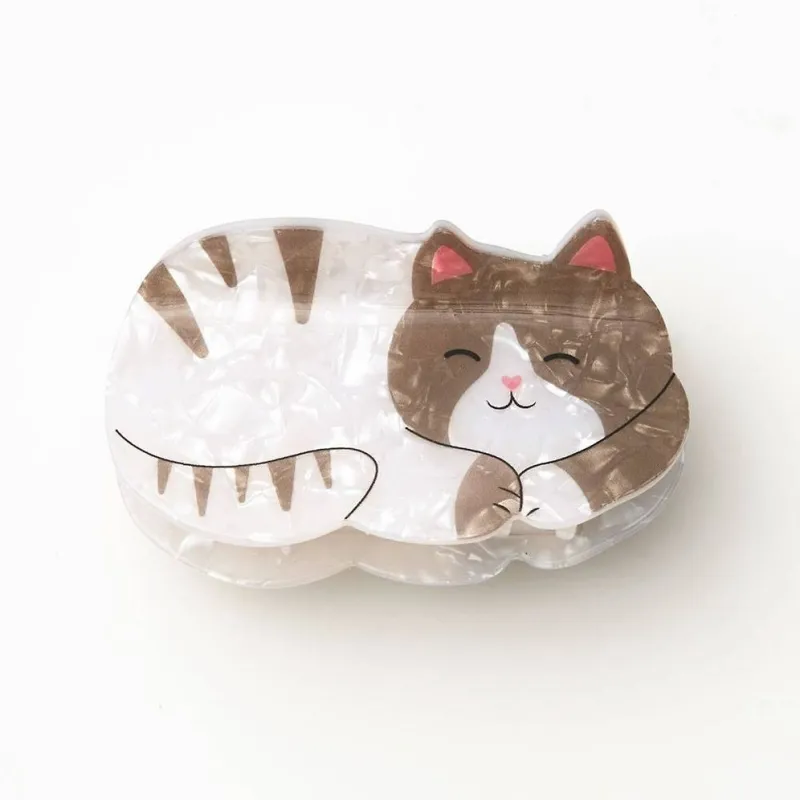 Curled Up Cat Hair Clip sold by Paper Source