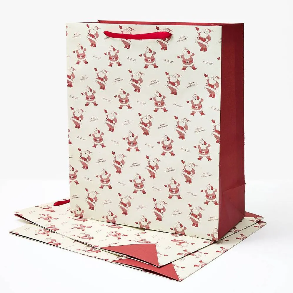 XL Newsprint Santas Gift Bag Set sold by Paper Source