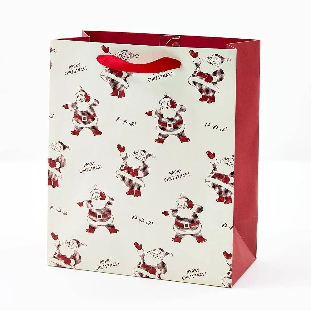 Newsprint Santas Medium Gift Bag sold by Paper Source