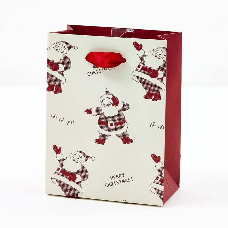 SM Newsprint Santas Gift Bag sold by Paper Source