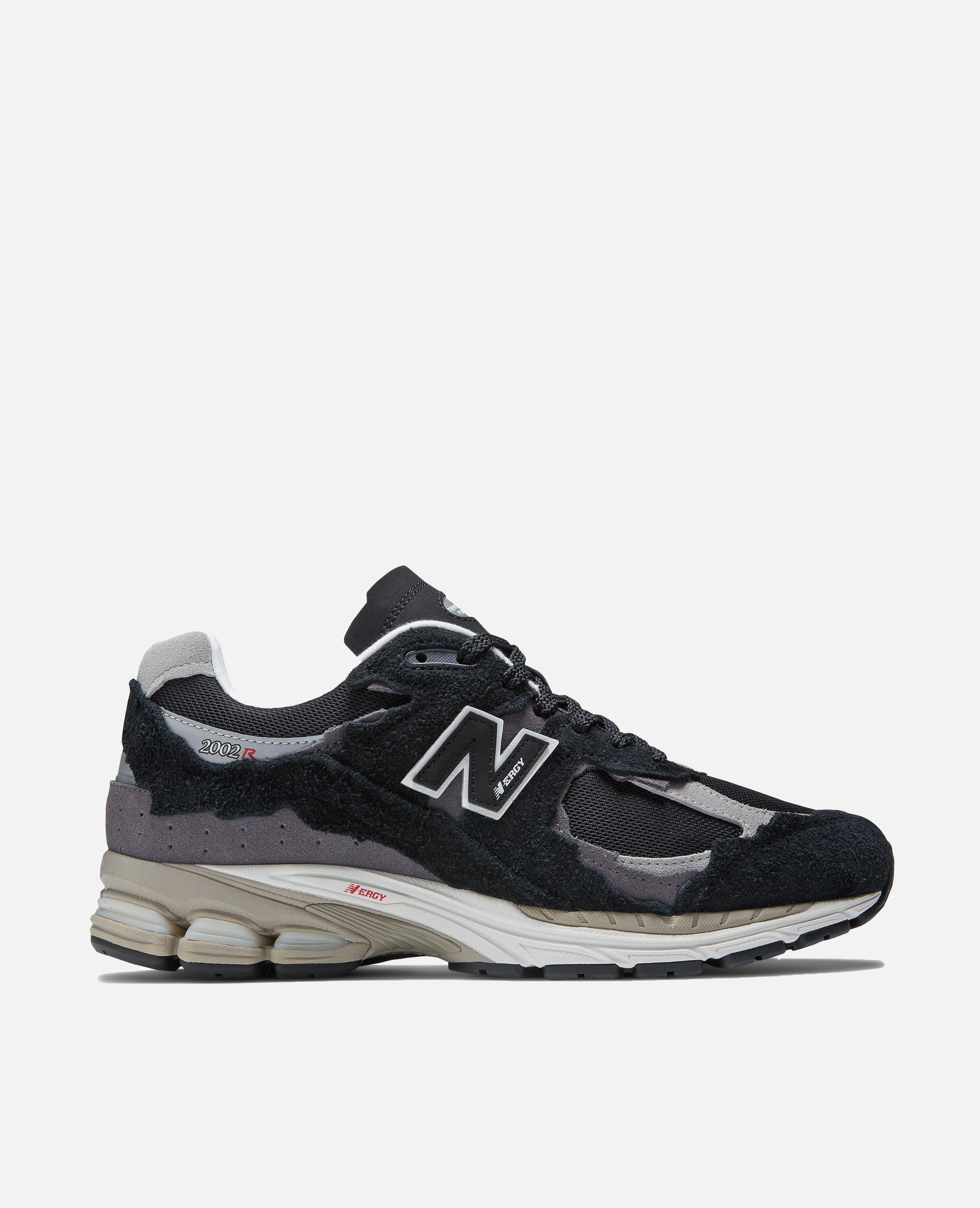 New Balance 2002R Protection Pack (Black) sold by Patta