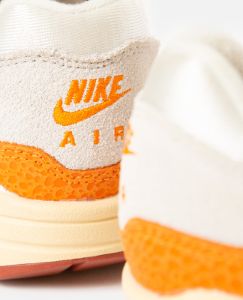 WMNS Nike Air Max 1 (Light Bone/Magma Orange-Neutral Grey) sold by Patta