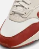 Nike WMNS Nike Air Max 1 LX (Saill/Rugged Orange-LT Orewood BRN) sold by Patta