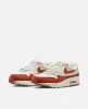 Nike WMNS Nike Air Max 1 LX (Saill/Rugged Orange-LT Orewood BRN) sold by Patta