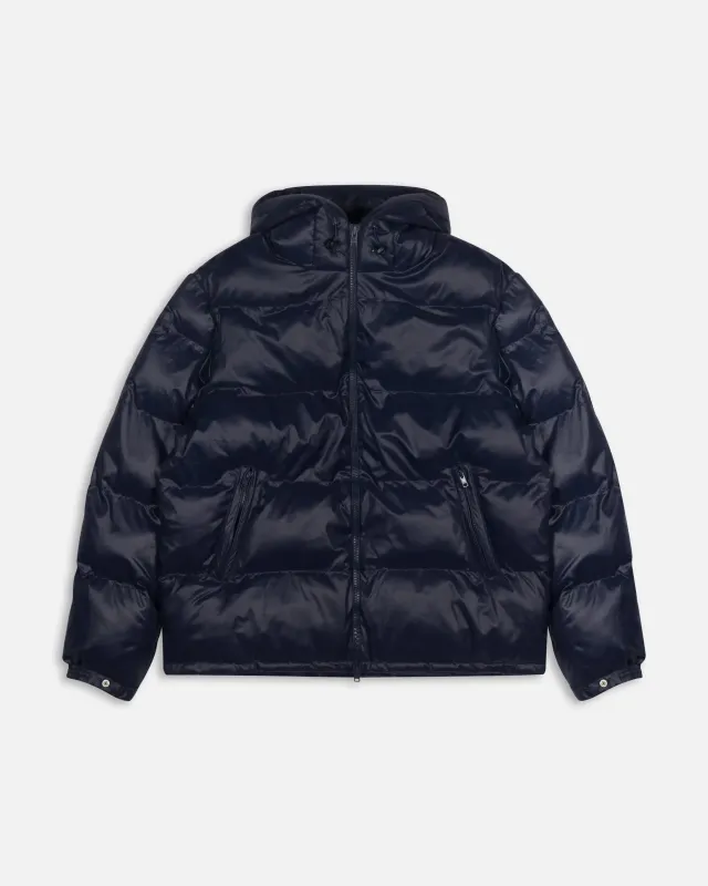 Patta Quilted Script Logo Puffer Jacket (Navy) sold by Patta