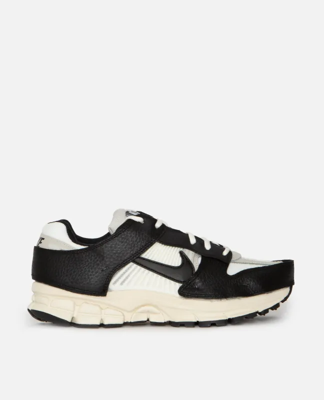 Nike WMNS Zoom Vomero 5 Timeless (Sail/Black-Light Bone-Wolf Grey) sold by Patta