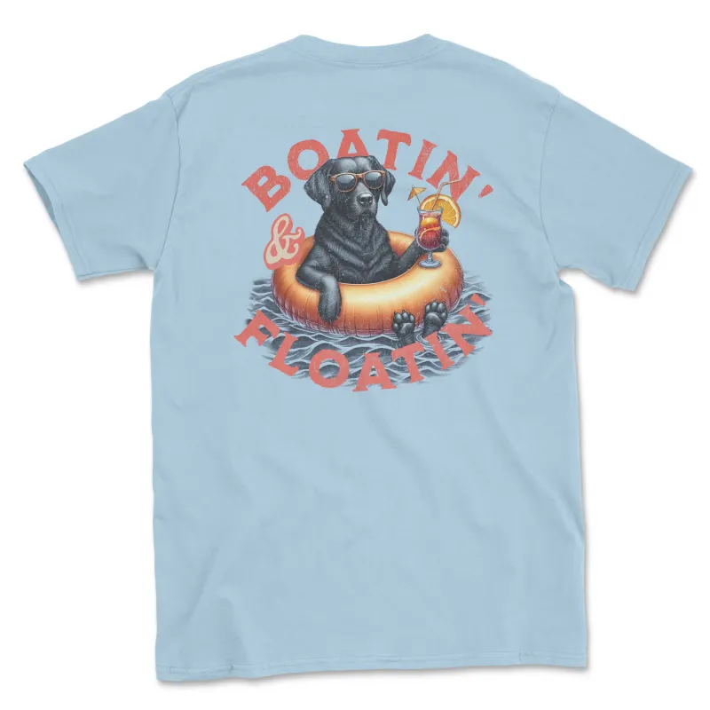 Boatin' & Floating' (Black Lab) (Adult Short Sleeve T-Shirt) sold by PAWZ