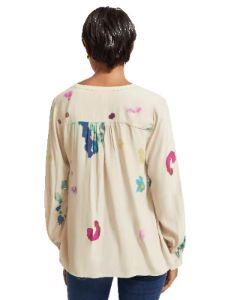 Lace-up blouse with balloon sleeves sold by Pepin