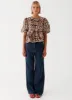 Western Wind Tie Top - Leopard sold by Peppermayo