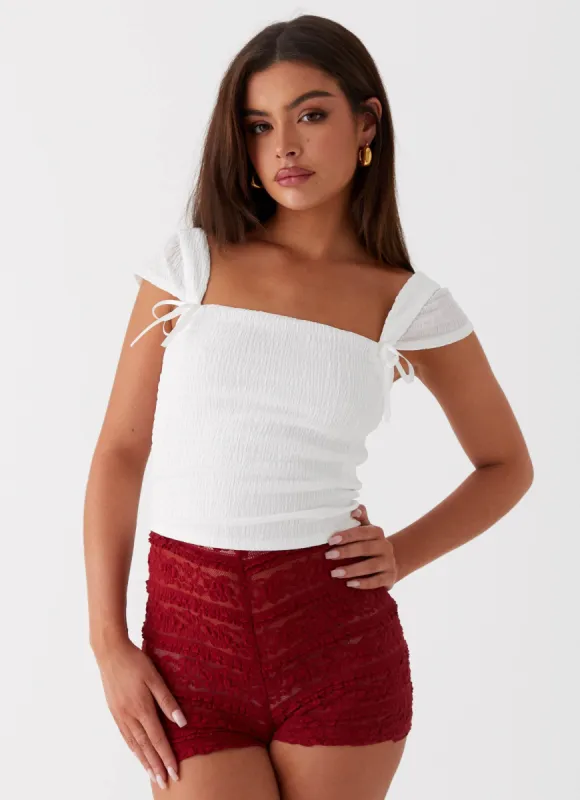 Rosalee Knit Bow Top - White made by Peppermayo
