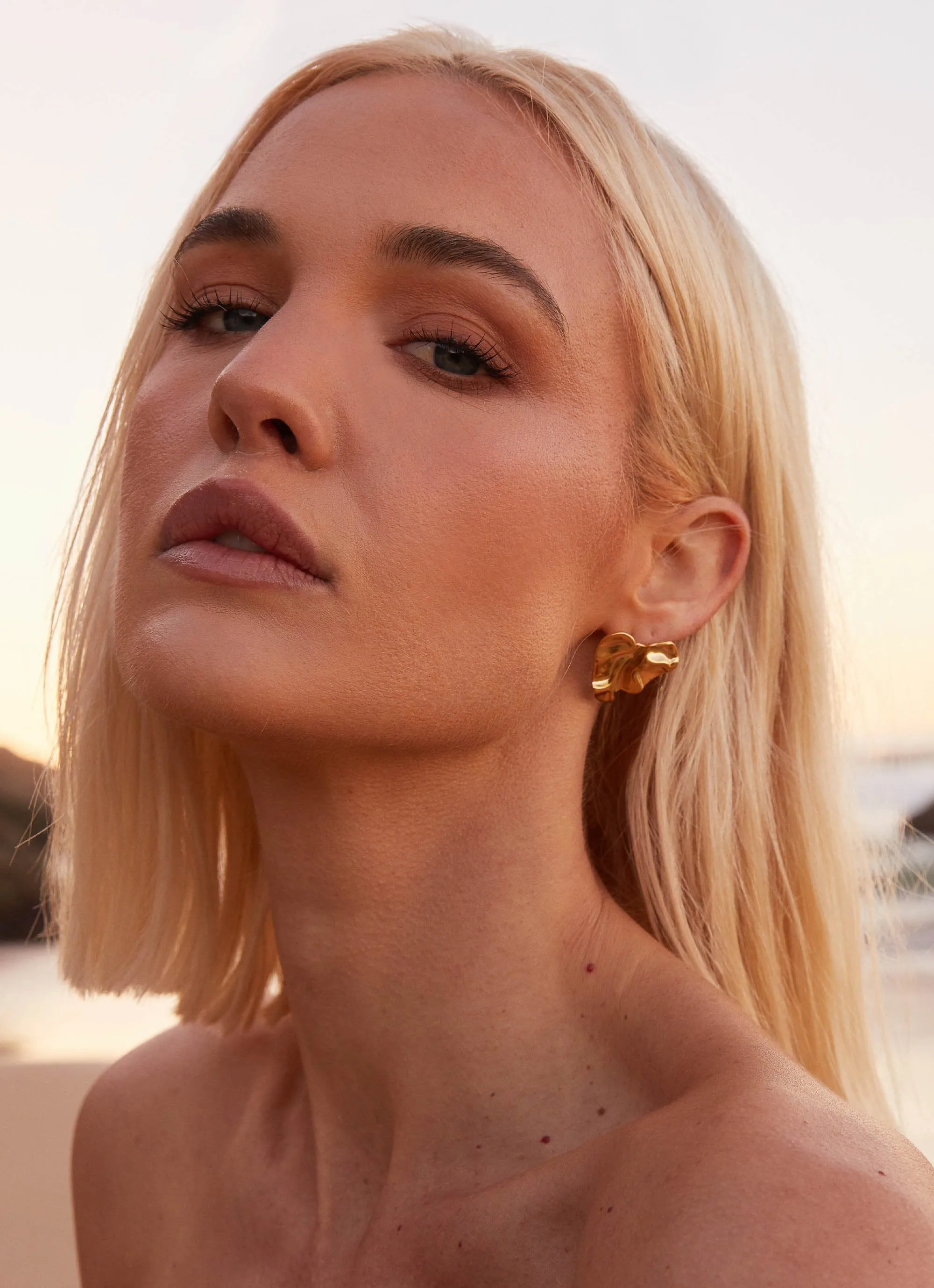 Heart To Heart Earrings - Gold sold by Peppermayo