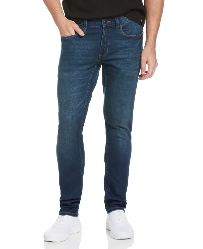 Recover™ Skinny Tinted Dark Wash Denim Jeans made by Perry Ellis