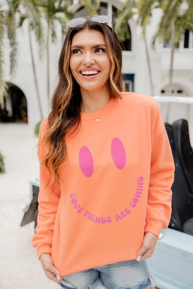 Good Things Are Coming Coral Oversized Graphic Sweatshirt sold by Pink Lily