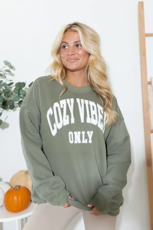 Cozy Vibes Olive Oversized Graphic Sweatshirt DOORBUSTER sold by Pink Lily