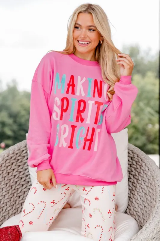 Making Spirits Bright Pink Oversized Graphic Sweatshirt sold by Pink Lily
