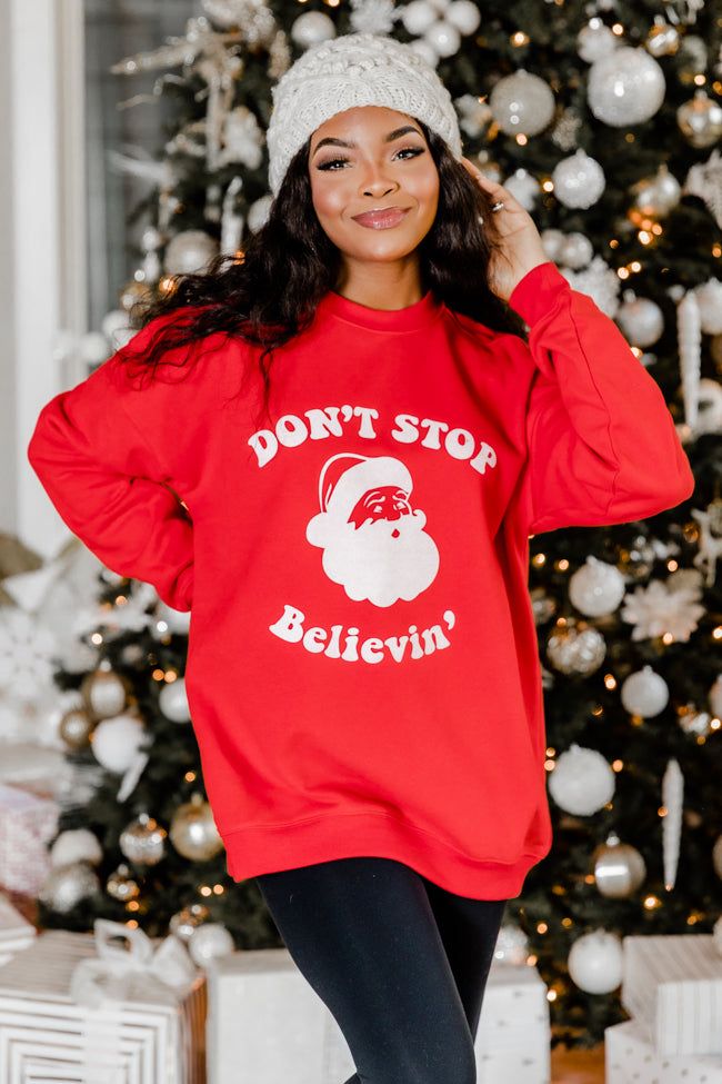 Don’t Stop Believin' Red Oversized Graphic Sweatshirt sold by Pink Lily