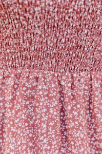 Magnificent Time Rust Smocked Spotted Ruffle Mini Dress FINAL SALE sold by Pink Lily