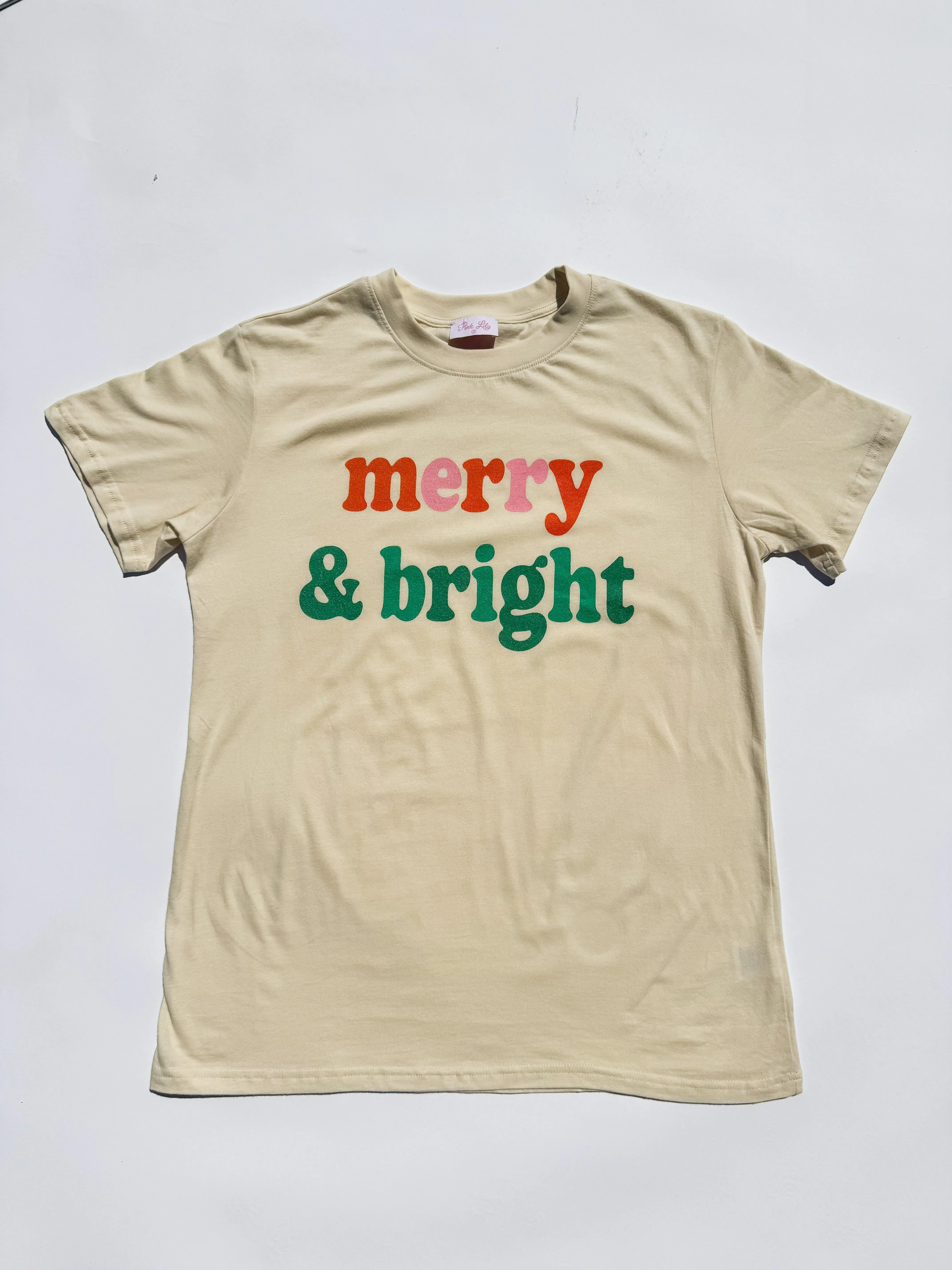 Merry And Bright Cream Oversized Graphic Tee sold by Pink Lily