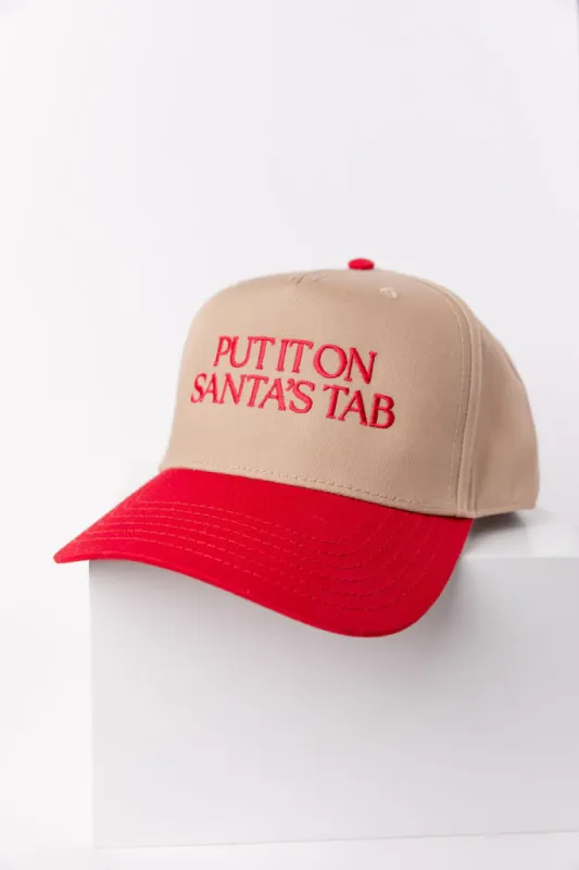 Put It On Santa's Tab Red and Khaki Trucker Hat sold by Pink Lily