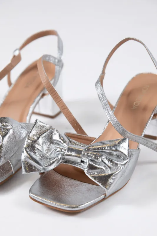 Drew Silver Bow Heel sold by Pink Lily