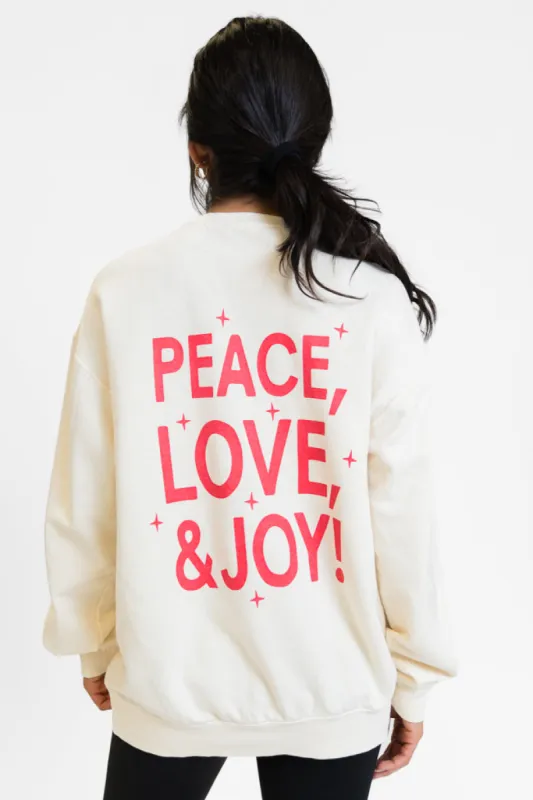 Peace Love And Joy Cream Oversized Graphic Sweatshirt sold by Pink Lily