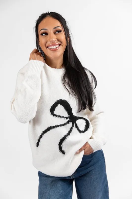 Feeling Like Love Ivory and Black Bow Crew Neck Sweater sold by Pink Lily