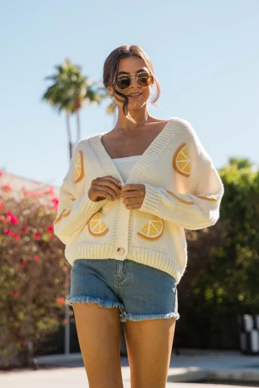 When Life Gives You An Ivory Lemon Slice Cardigan sold by Pink Lily