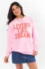 Living The Dream Light Pink Graphic Sweatshirt sold by Pink Lily