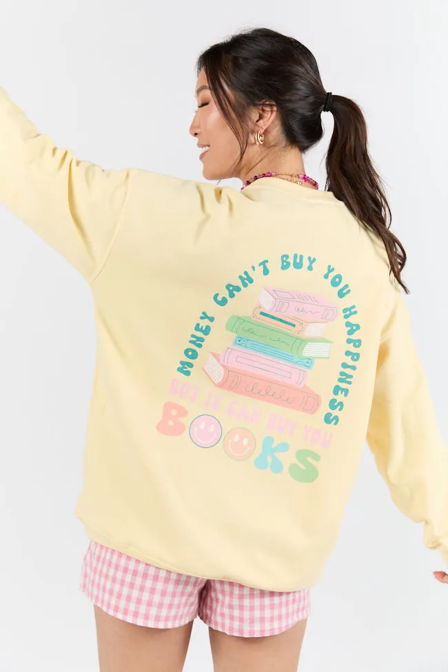 Can't Buy You Happiness But Can Buy Books Light Yellow Graphic Sweatshirt sold by Pink Lily