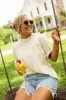 The Kollyns Happy Lil' Thang Ivory Graphic Tee Holley Rojek X Pink Lily sold by Pink Lily