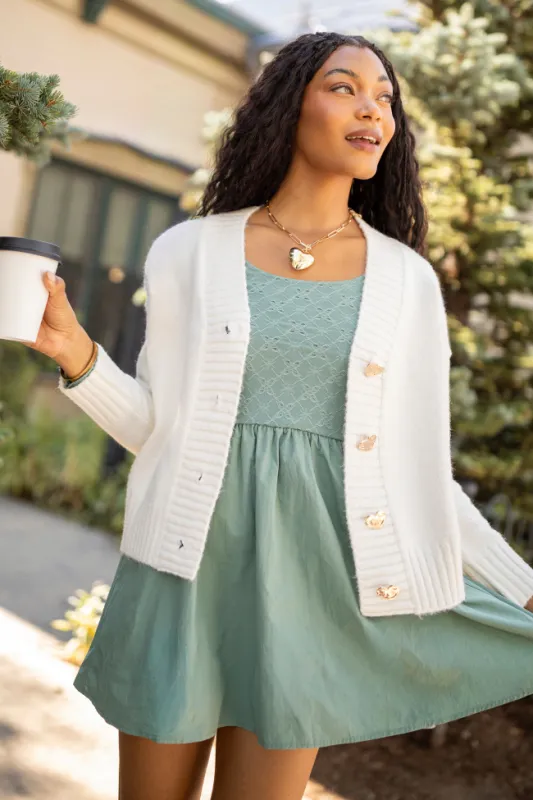 Marina Sage Eyelet Mini Dress sold by Pink Lily