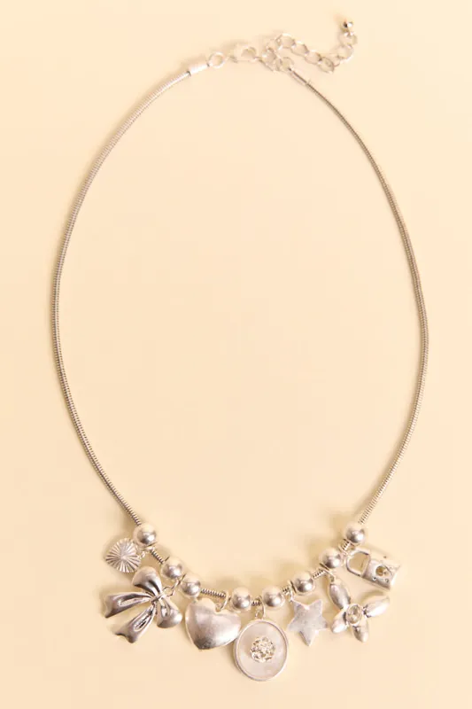 Noelle Silver Charm Necklace sold by Pink Lily