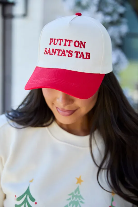 Put It On Santa's Tab Red Trucker Hat sold by Pink Lily