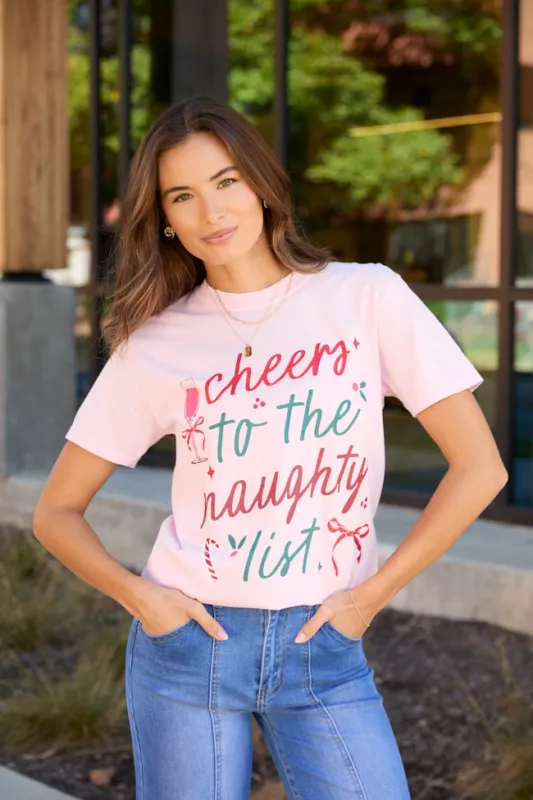 Cheers To The Naughty List Light Pink Graphic Tee sold by Pink Lily