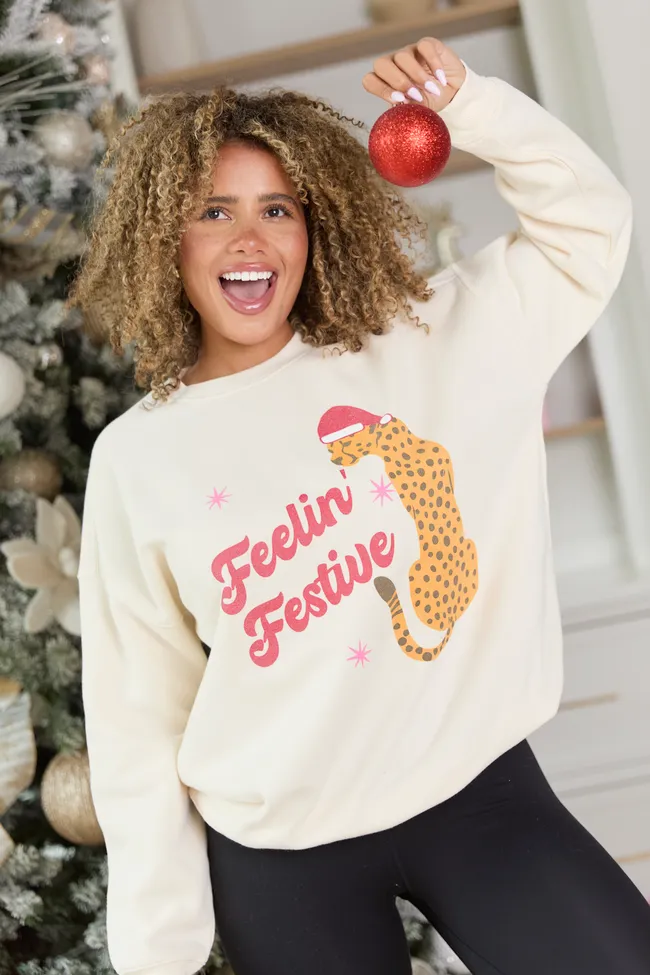 Feelin' Festive Cream Graphic Sweatshirt sold by Pink Lily