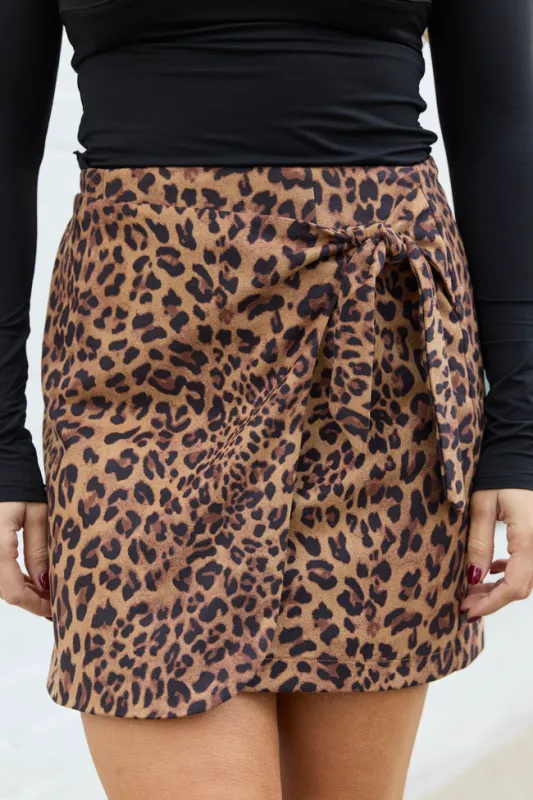 Elena Leopard Print Faux Leather Wrap Skirt sold by Pink Lily