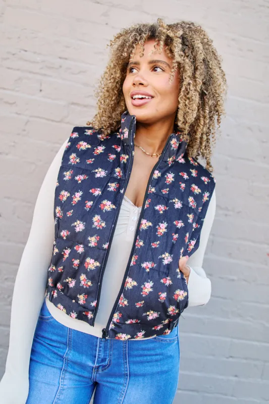 Janice Black Floral Print Puffer Vest sold by Pink Lily