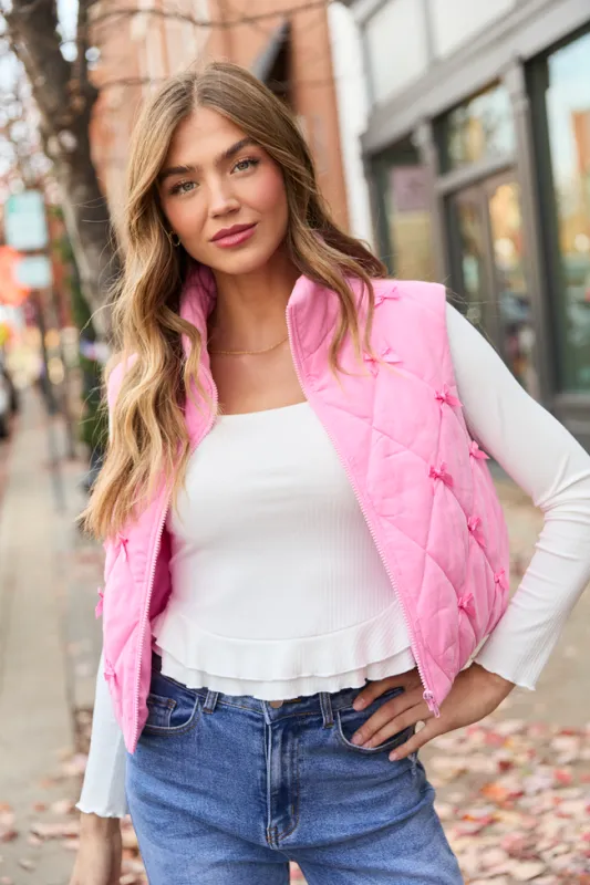 Ari Pink Bow Puffer Vest sold by Pink Lily