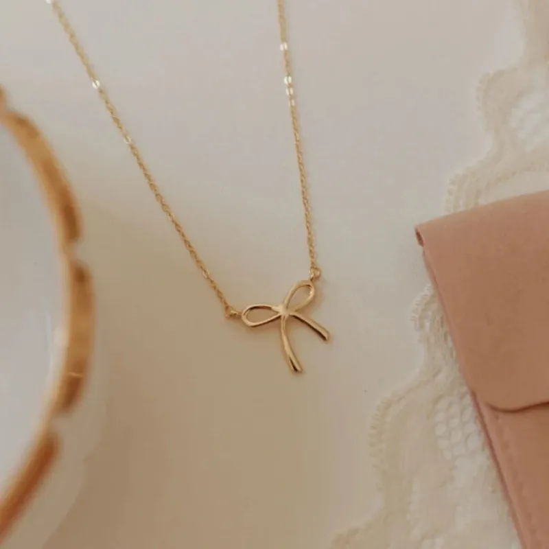 Lily Bow Necklace sold by Pink Lily