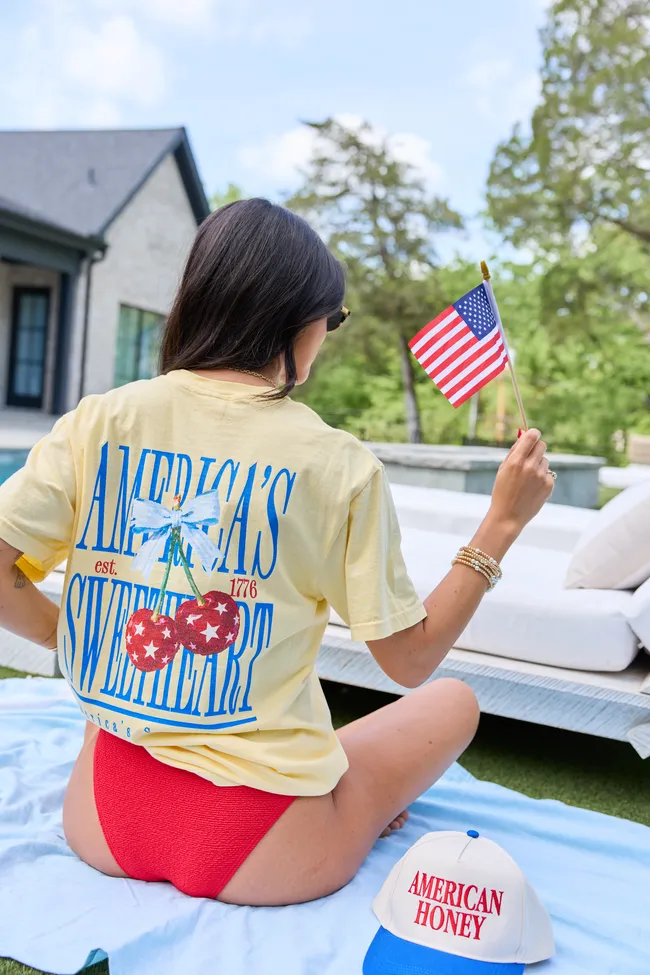 America's Sweetheart Cherry Yellow Graphic Tee sold by Pink Lily