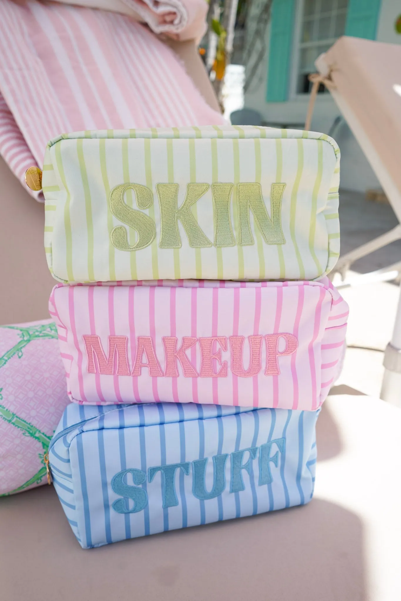 Striped Travel- Ready Cosmetic Bags sold by Pink Lily