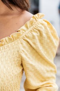 Trying Not To Call Smocked Yellow Blouse sold by Pink Lily