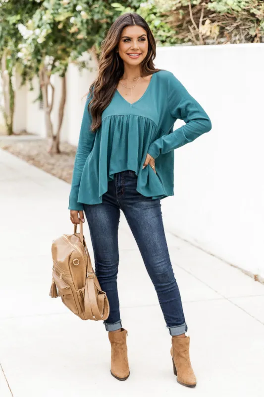 Keep Driving Home Teal Long Sleeve Peplum top sold by Pink Lily