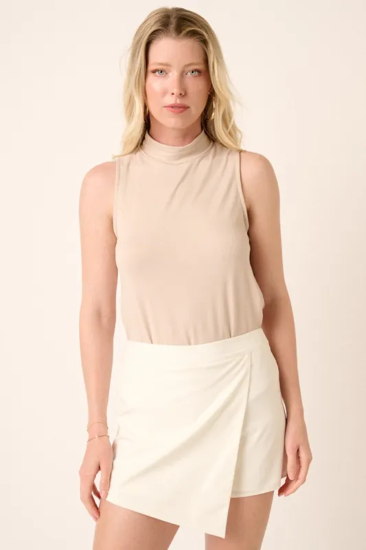 Beige Sleeveless Mock Neck Top sold by Pinkblush